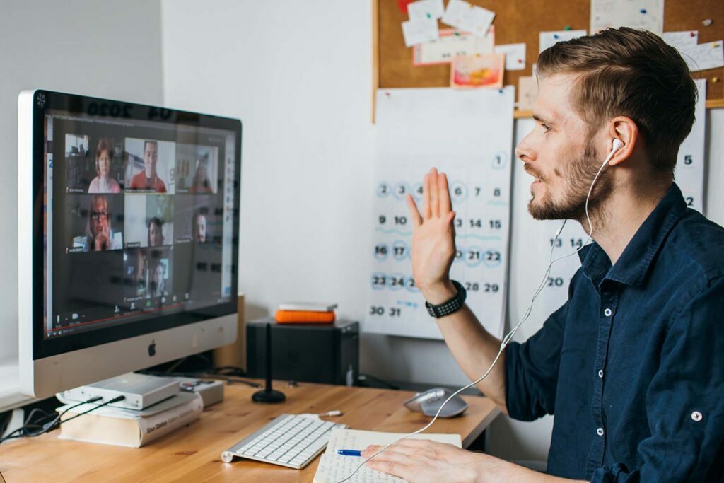 man on video call in home office