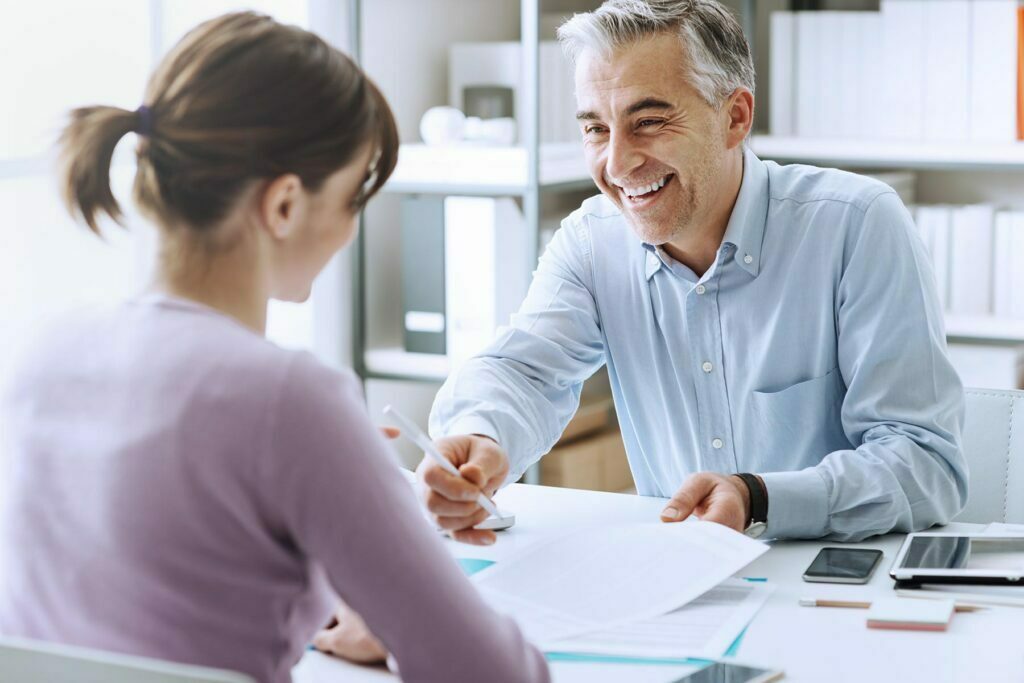 happy man explaining tax things to person