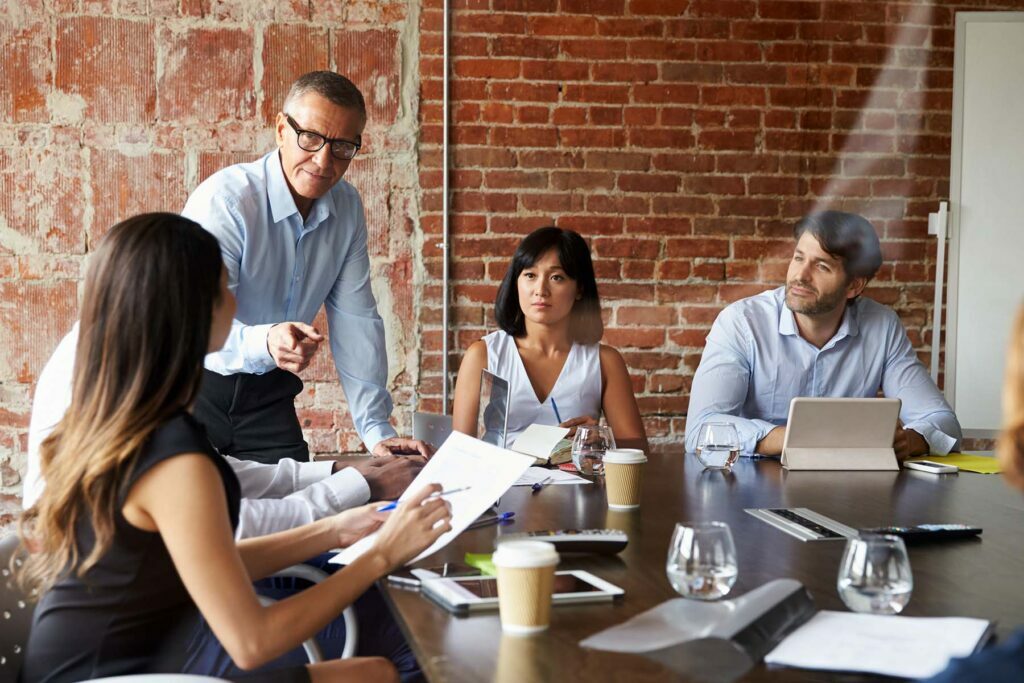 man talking about budgeting in a meeting