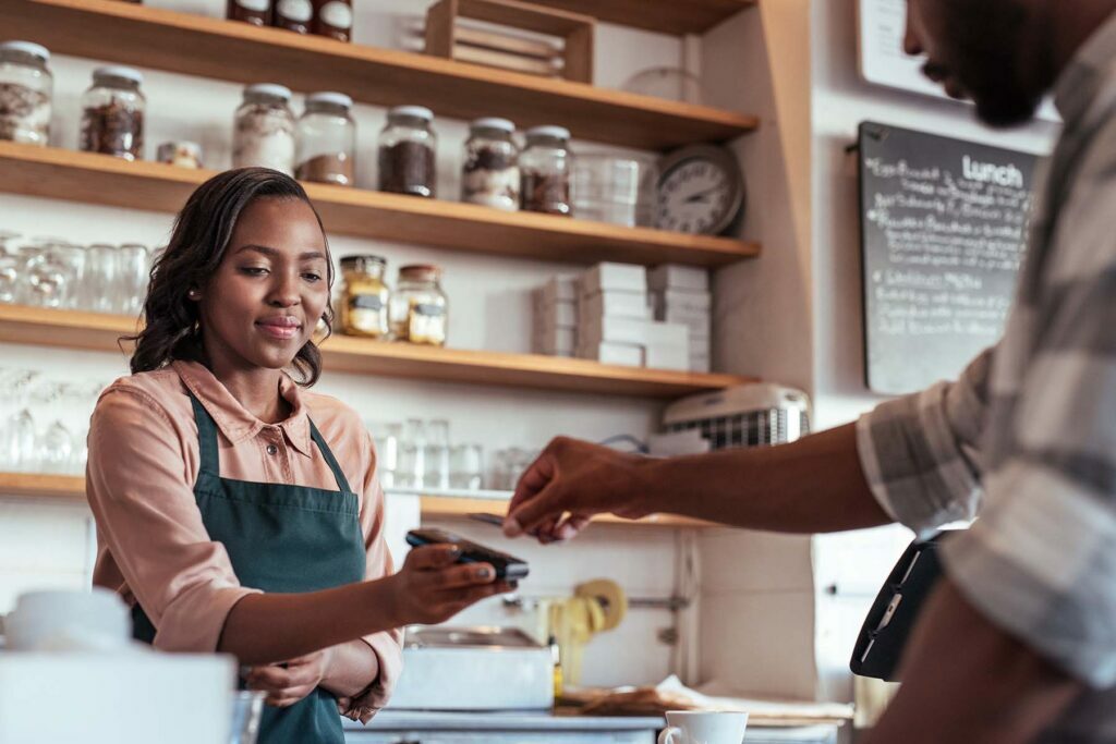 employee taking payment from customer
