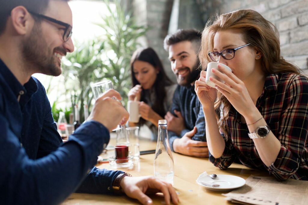 happy coworkers talking about expenses