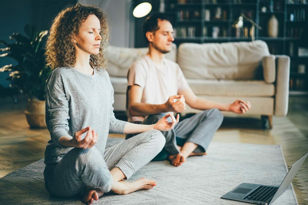 two people doing yoga for mindfulness