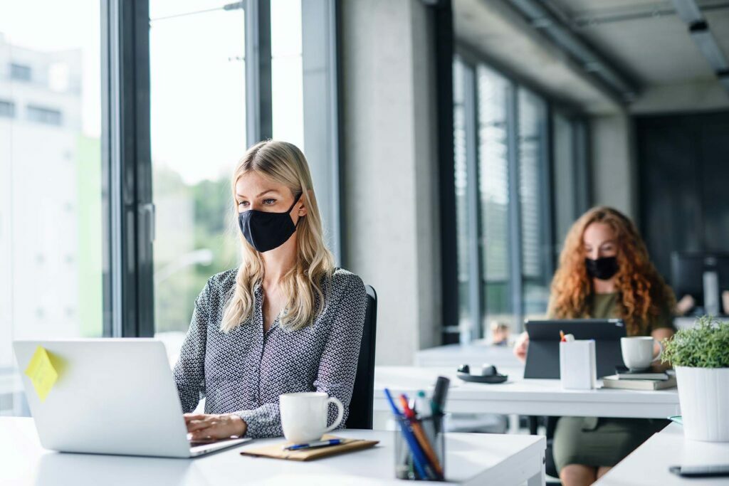 office workers wearing masks for covid-19