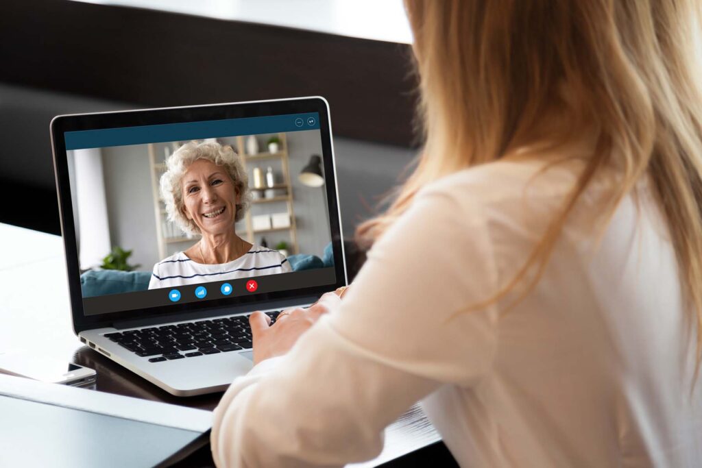lady on a virtual call with elder lady as part of her new year Resolution