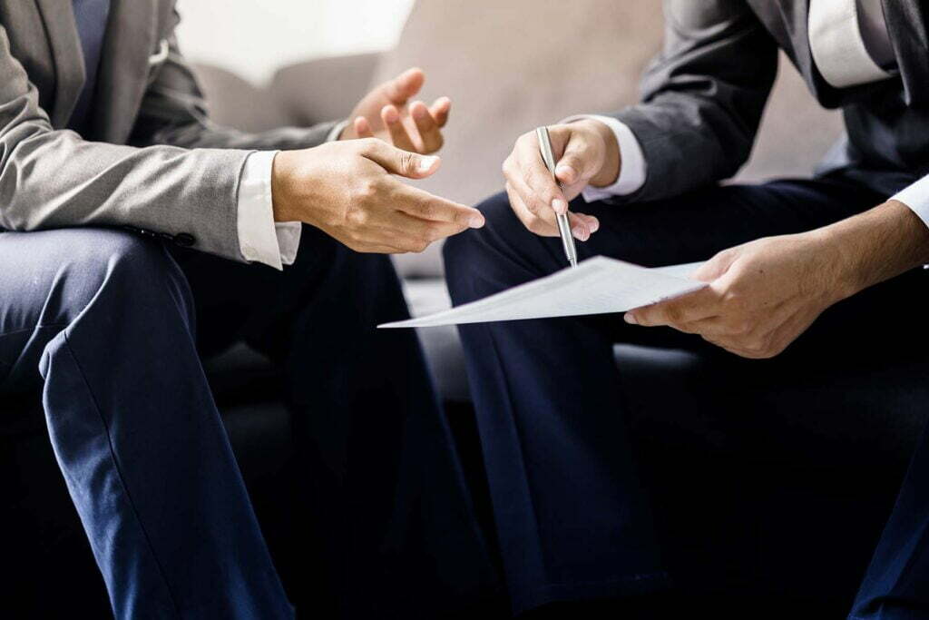 two professionals talking about tax rules