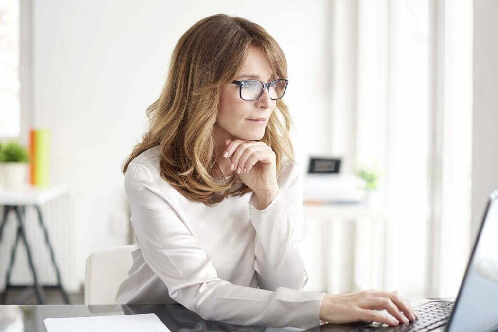 lady searching on her computer about business income