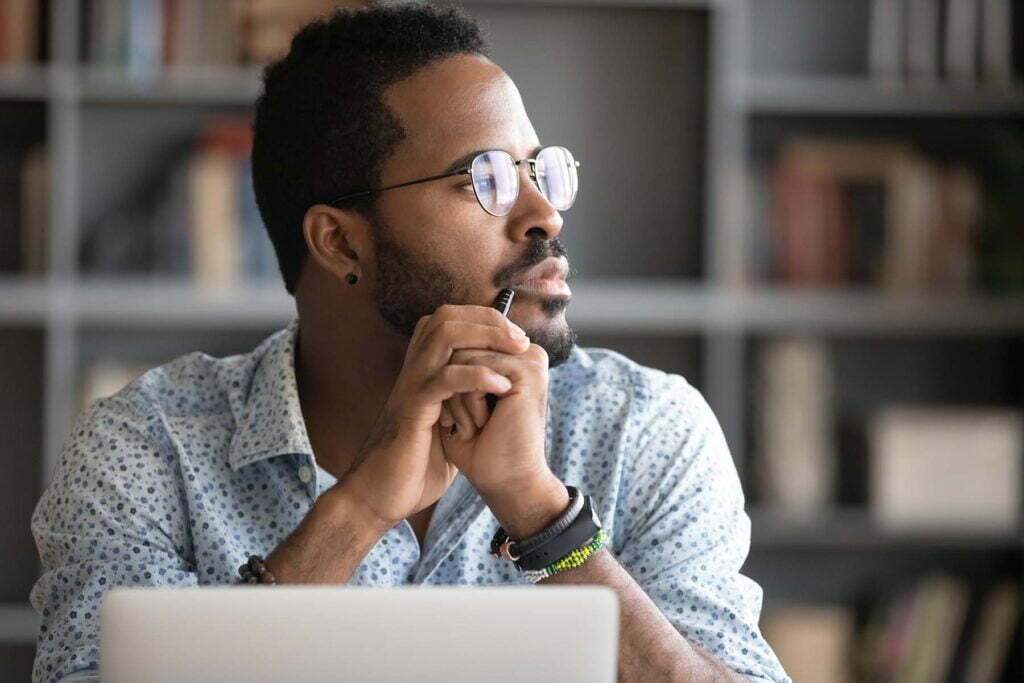 business man looking thoughtfully into the distance