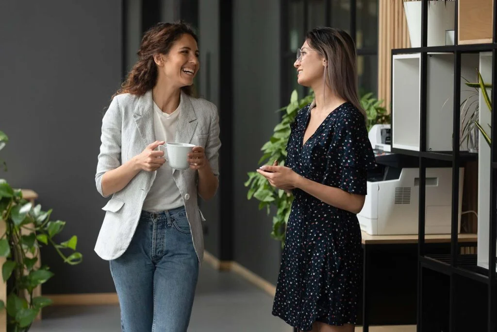 two coworkers talking about career goals