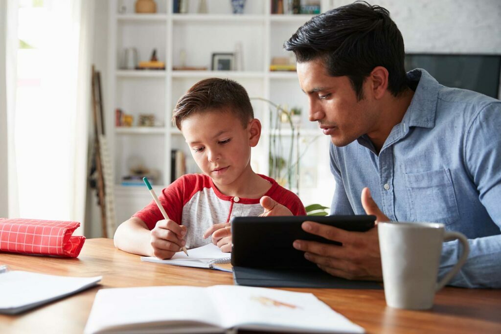 father helping his son back to school online
