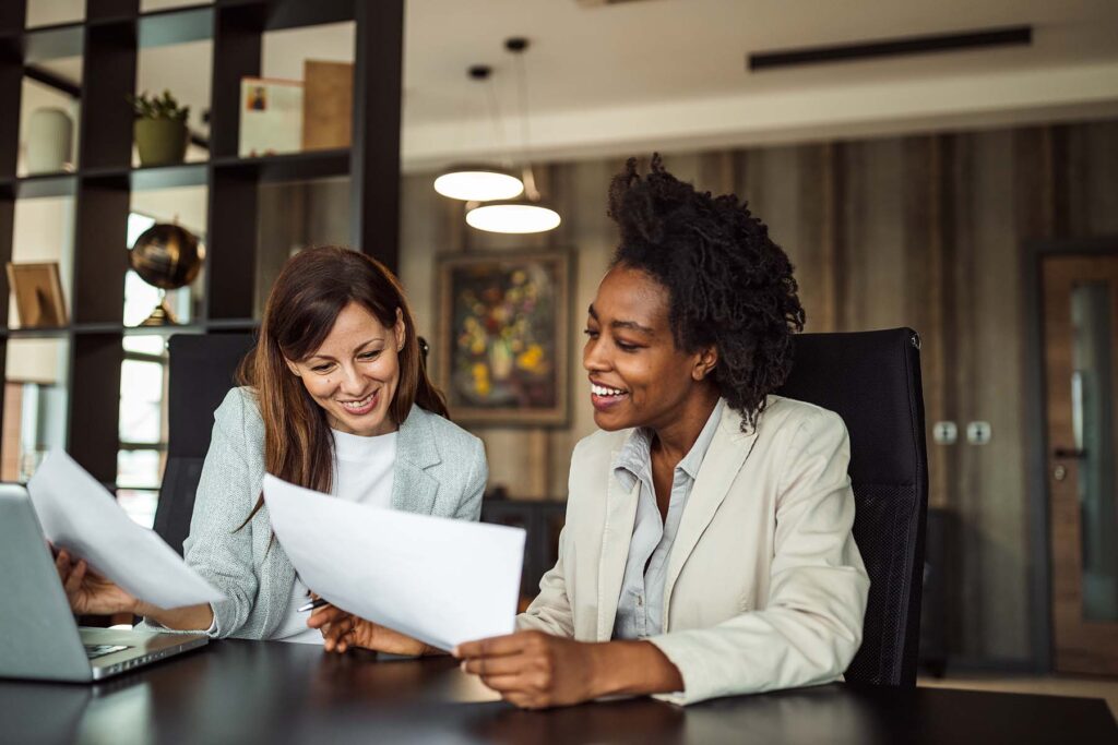 two coworkers looking tax tips