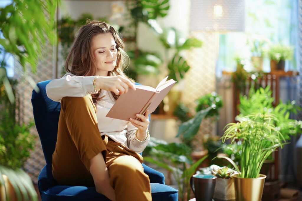 happy lady reading books on a staycation